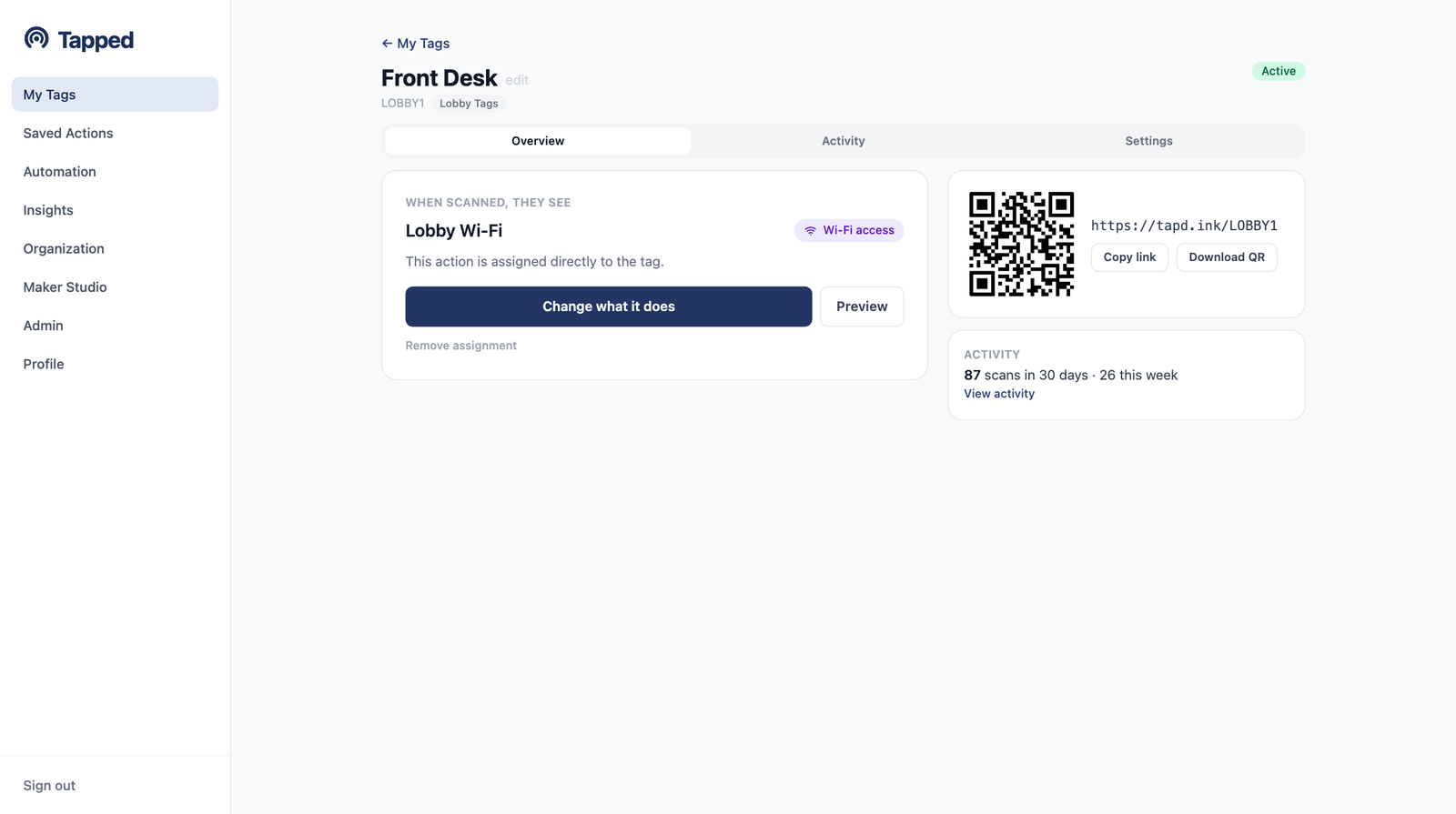 A tag's page in the Tapped dashboard showing what people see when they scan, the QR code card, and recent activity
